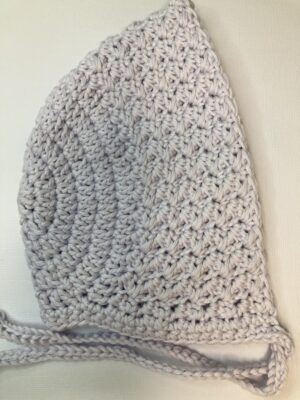 lavendar coloured crochet baby bonnet