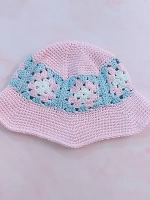 pale pink crochet bucket hat with blue granny squares